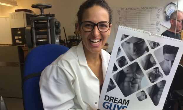 Audrey from Asprey holding Dream Guys Calendar